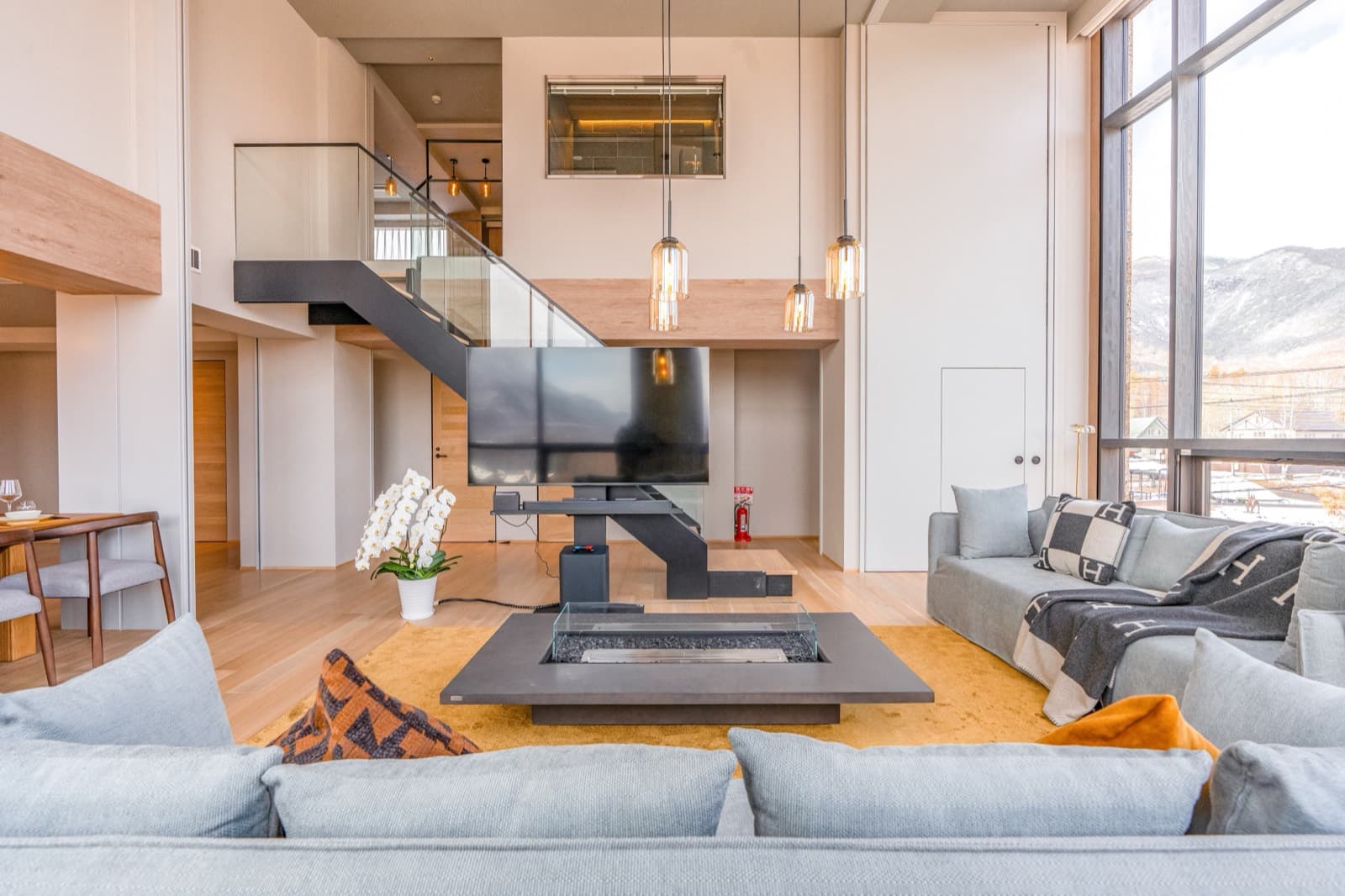 Lobby — central hearth, double-height great room